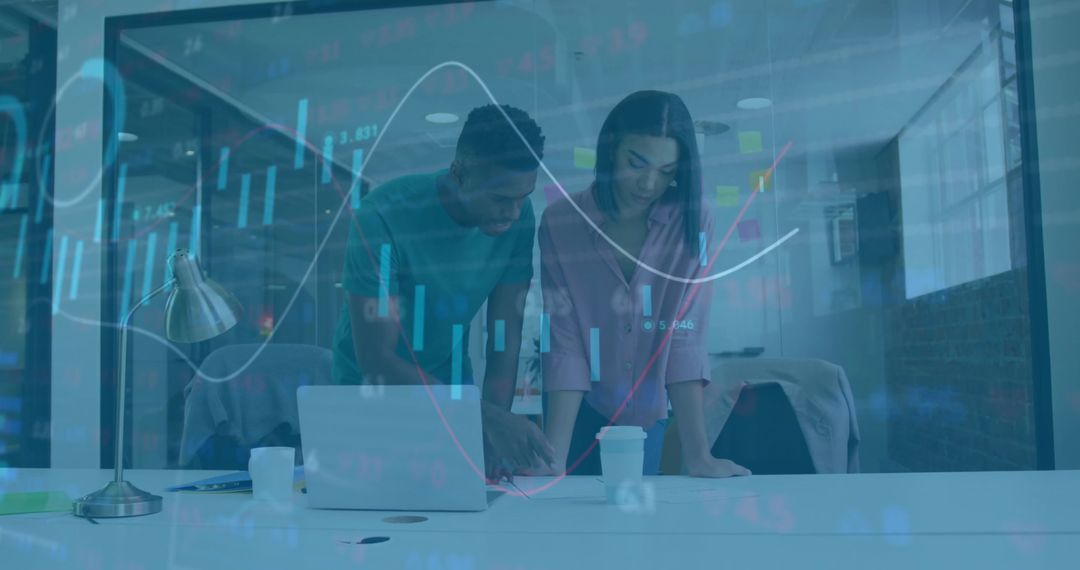 Business Team Analyzing Data Charts in Modern Office Environment