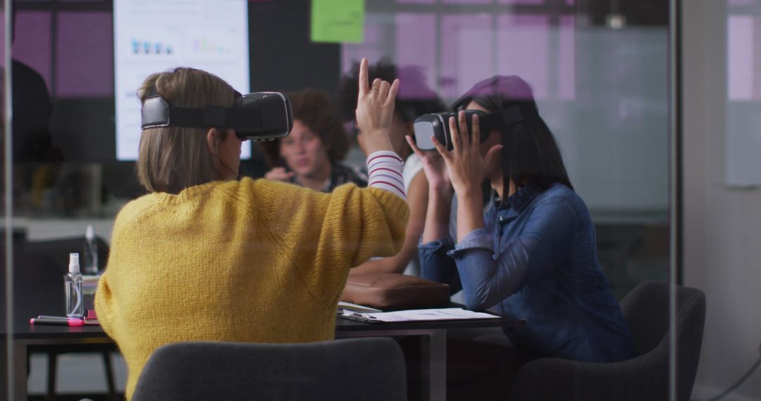 Businesswomen Using VR Headsets During Office Meeting - Free Images, Stock Photos and Pictures on Pikwizard.com