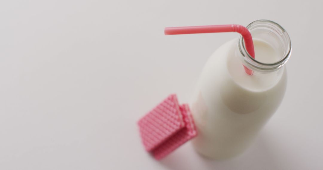 Fresh Milk in Glass Bottle with Pink Straw and Waffle - Free Images, Stock Photos and Pictures on Pikwizard.com