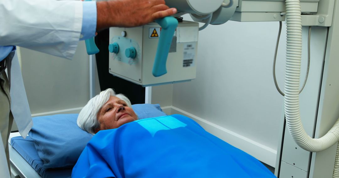 Elderly Woman Receiving X-Ray Examination at Hospital - Free Images, Stock Photos and Pictures on Pikwizard.com