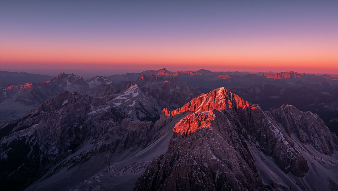Majestic Alpine Peak at Sunrise with Red Alpenglow