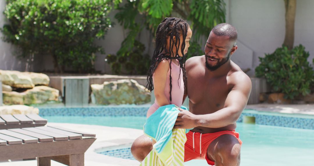 Father and Daughter Enjoying Quality Time by Swimming Pool
