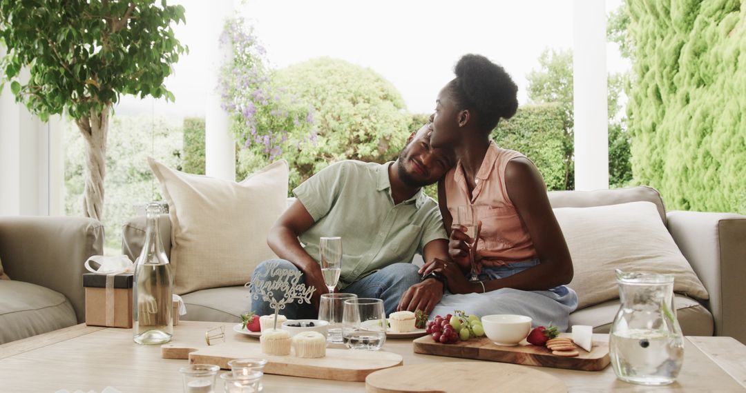 Young Couple Celebrating Anniversary With Desserts and Champagne Outdoors