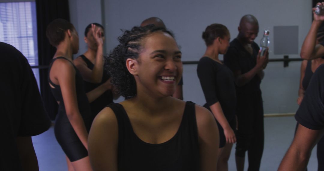 Group of Smiling Dancers Rehearsing Together in Studio - Free Images, Stock Photos and Pictures on Pikwizard.com