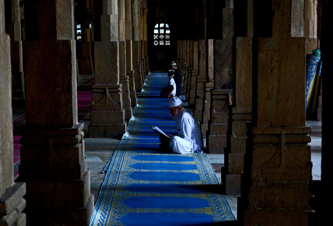 Men reading Quran in Mosque during prayer time - Free Images, Stock Photos and Pictures on Pikwizard.com