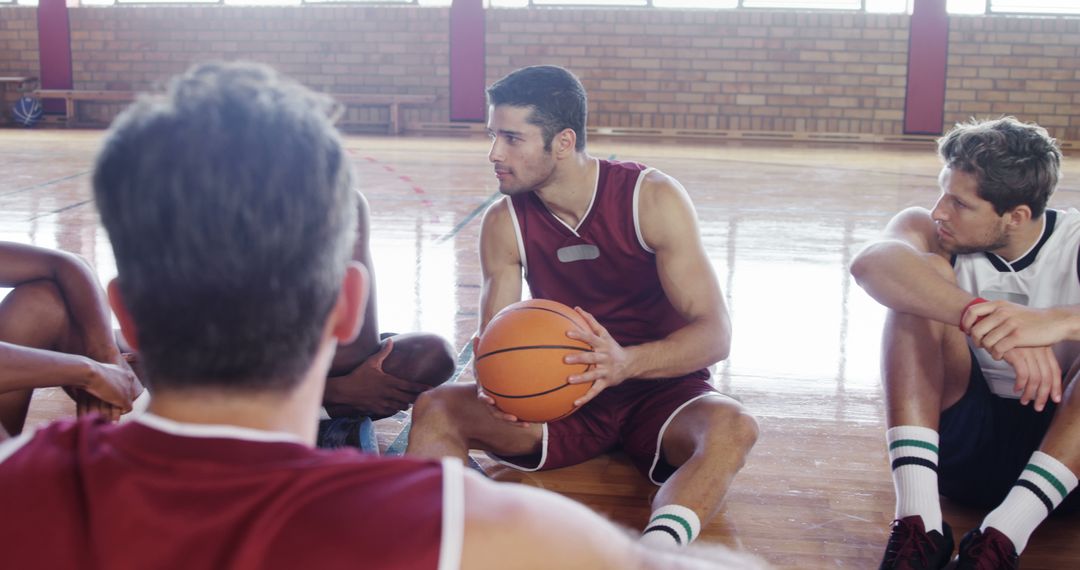Young Basketball Players Discussing Strategy with Teammates