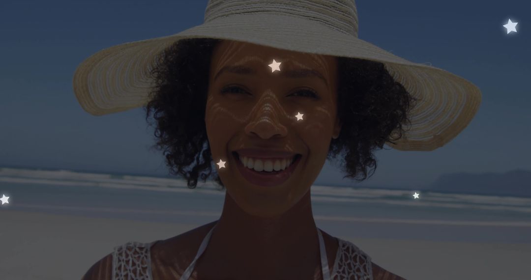 Smiling Woman with Straw Hat Enjoying Sunny Beach Day