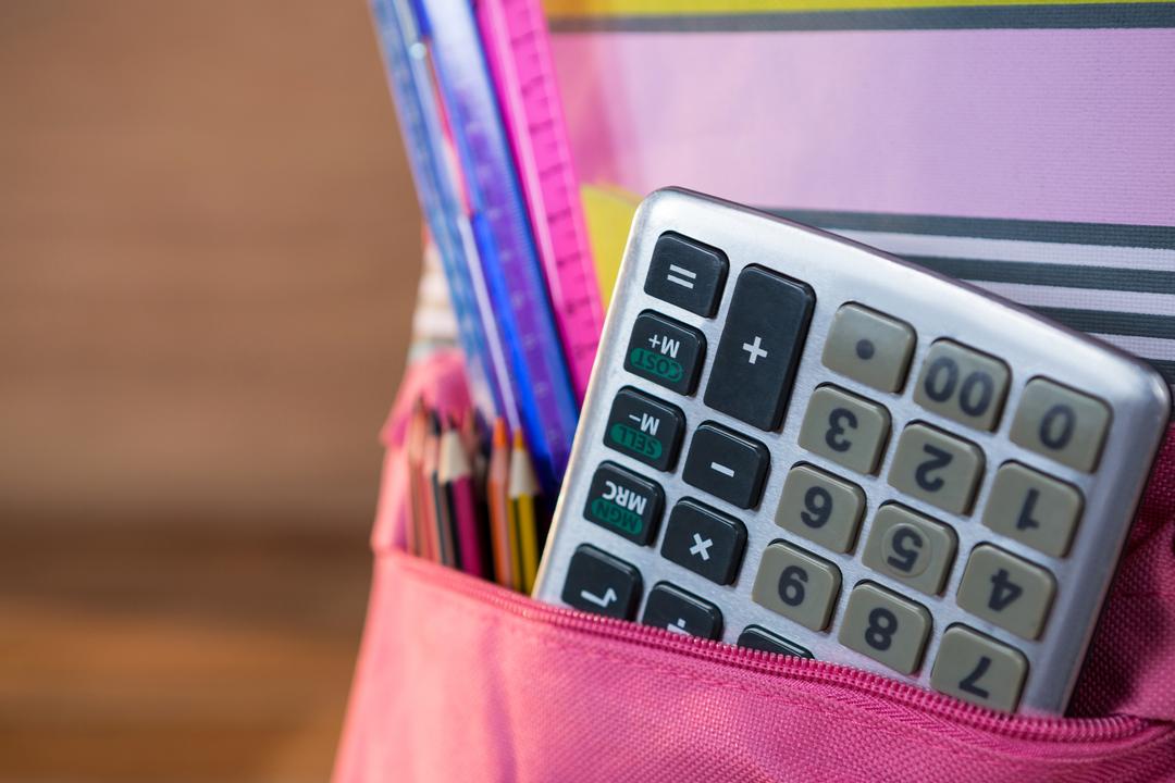 Close-Up of Calculator and School Supplies in Backpack - Free Images, Stock Photos and Pictures on Pikwizard.com