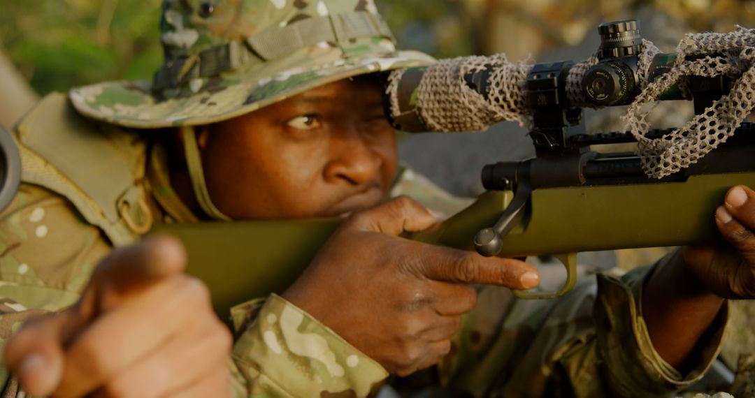 African American Soldier in Camouflage Aiming Sniper Rifle in Forest - Free Images, Stock Photos and Pictures on Pikwizard.com