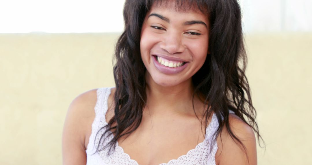 Happy Young African American Woman Smiling Indoors - Free Images, Stock Photos and Pictures on Pikwizard.com