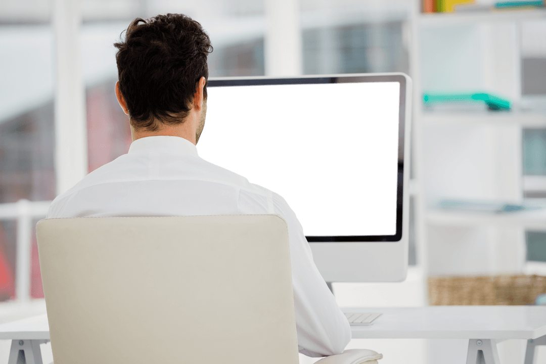 Businessman at Desk with Transparent Computer Screen in Modern Office
