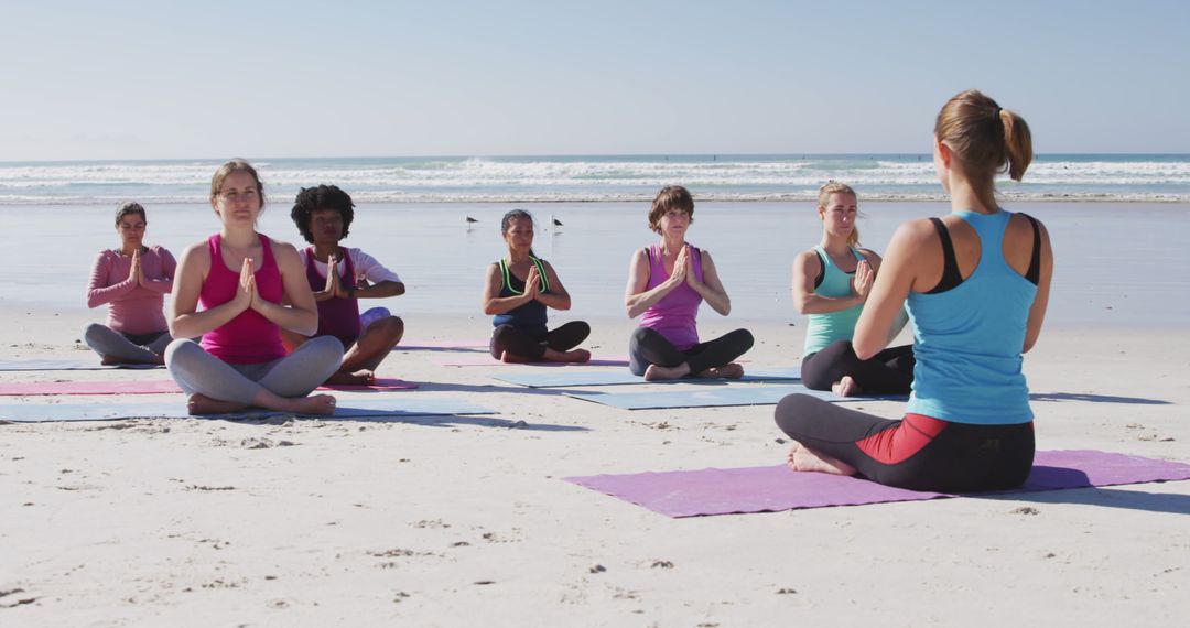 Group Yoga Class Meditating on Beach in Sunny Weather - Free Images, Stock Photos and Pictures on Pikwizard.com