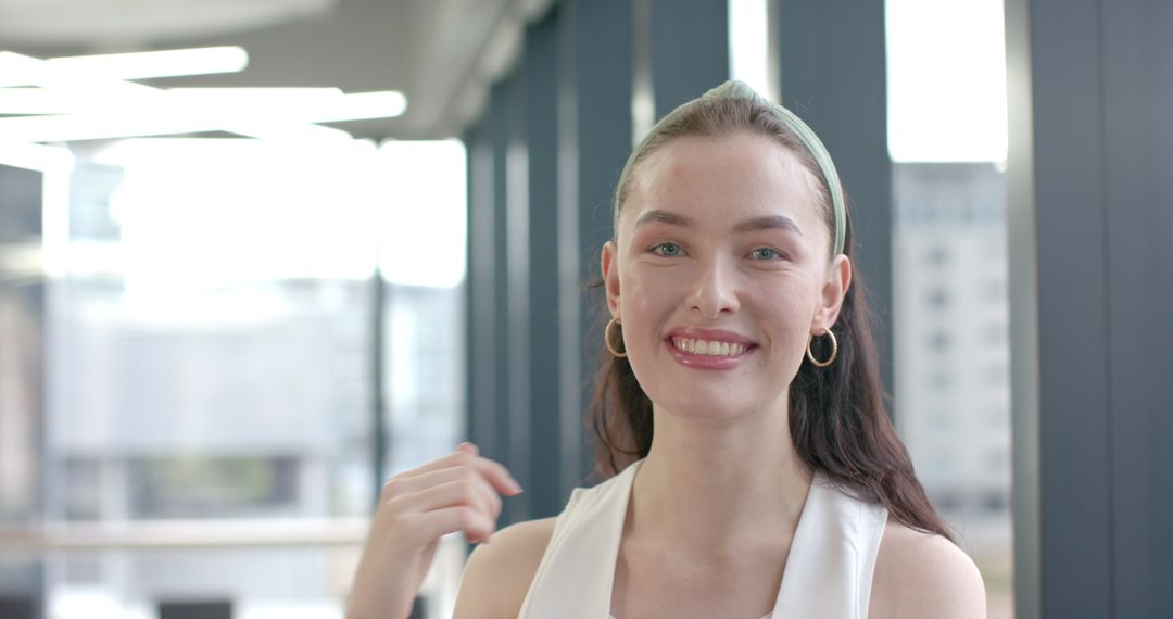 Smiling Woman in Modern Office with Elegant Décor