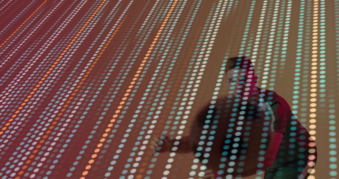 Man Engaging with Vibrant LED Panel Display in Modern Space