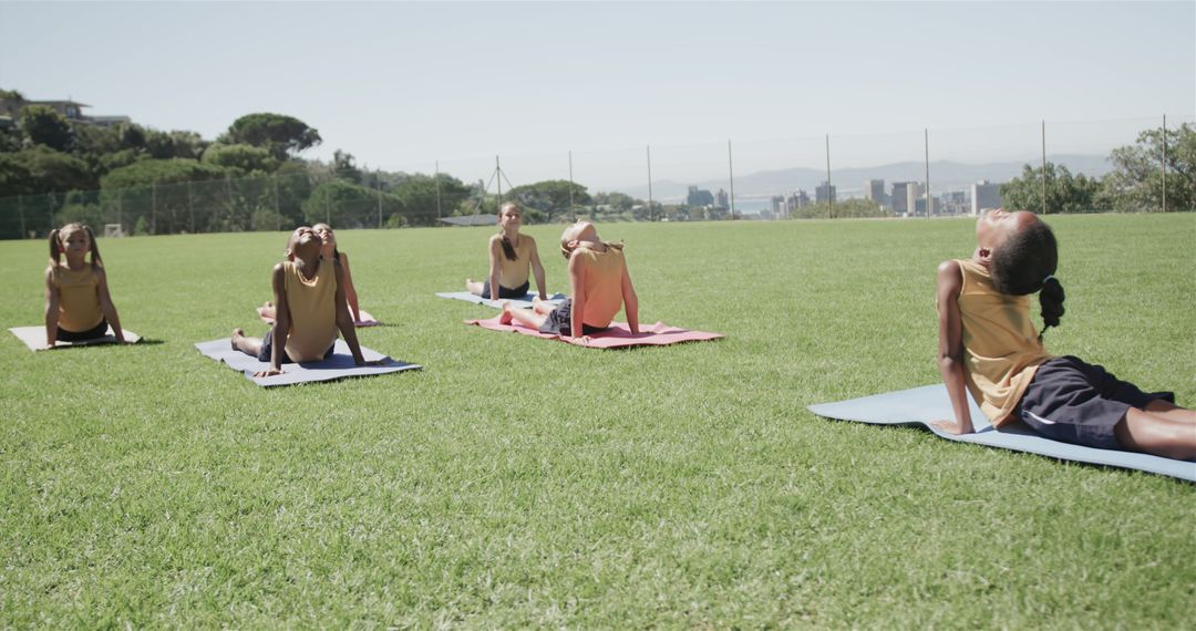 Young Children Practicing Outdoor Yoga on Mats - Free Images, Stock Photos and Pictures on Pikwizard.com