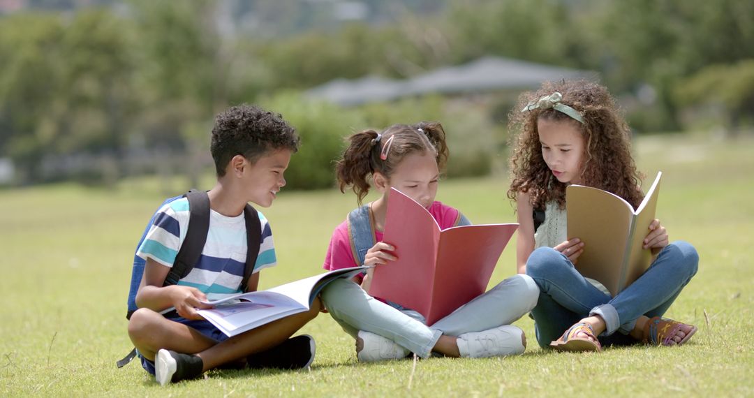 Children Reading Together on Grass Embracing Love for Learning