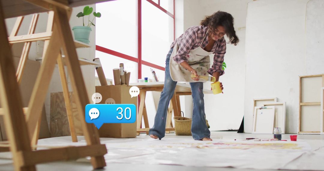 Creative Artist Painting in Sunlit Studio