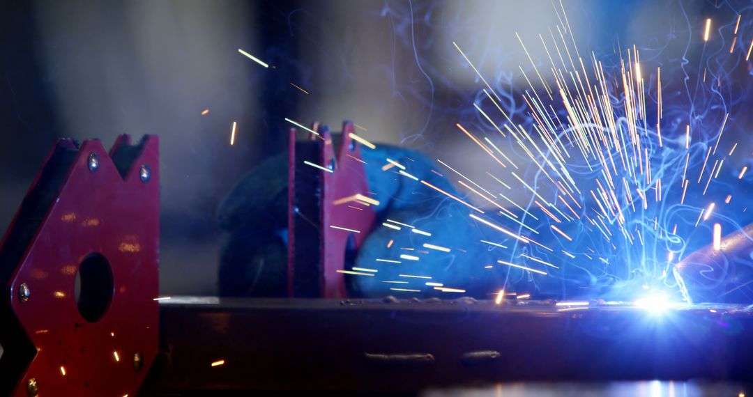 Professional Welder Wearing Gloves Welding Metal with Sparks Flying - Free Images, Stock Photos and Pictures on Pikwizard.com