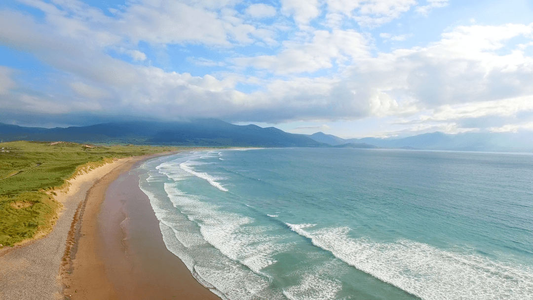 Transparent Waves Gently Touching Shore in Serene Coastal Landscape