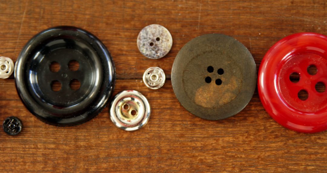 Close-Up of Assorted Buttons on Wooden Surface - Free Images, Stock Photos and Pictures on Pikwizard.com