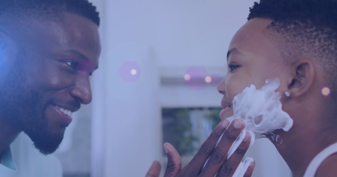 Father Helping Son Shave to Bond During Routine