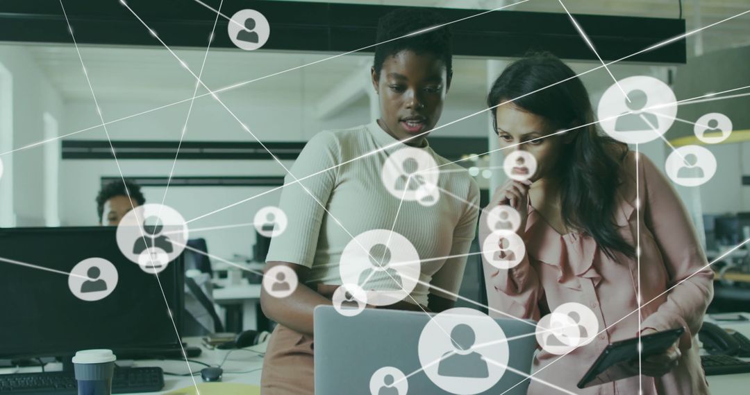 Diverse Female Colleagues Analyzing Data with Technology Network Overlay