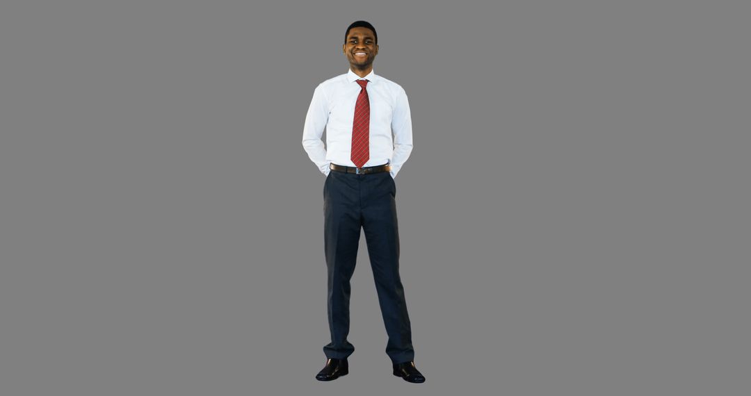 Confident Businessman Smiling in Formal Attire on Grey Background