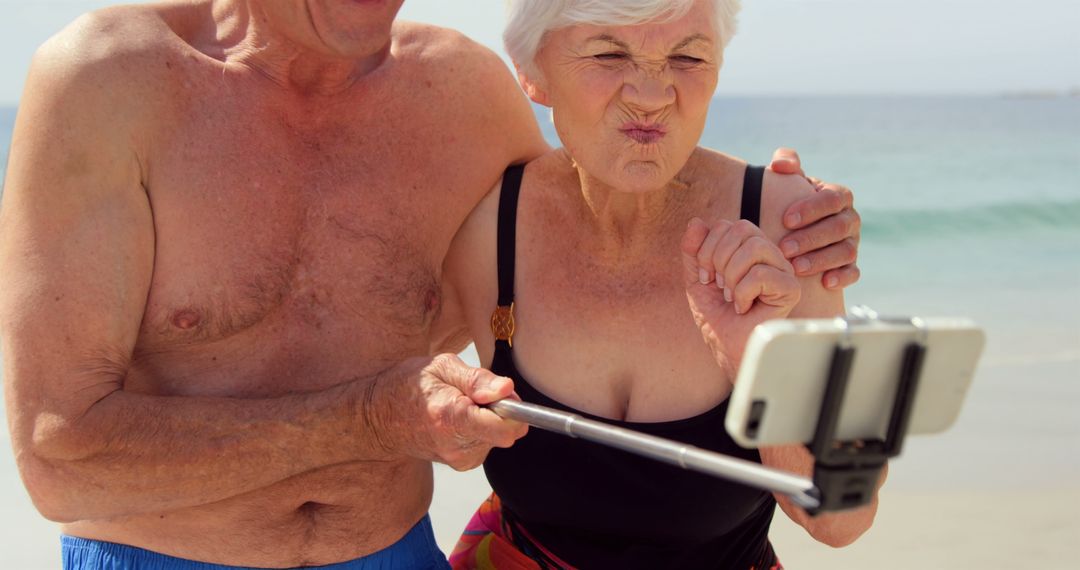 Cute couple taking selfie on the beach - Free Images, Stock Photos and Pictures on Pikwizard.com