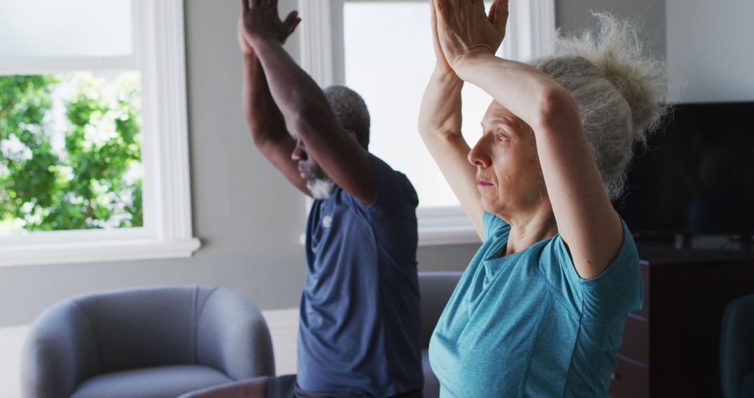 Senior Couple Practicing Yoga Together at Home - Free Images, Stock Photos and Pictures on Pikwizard.com