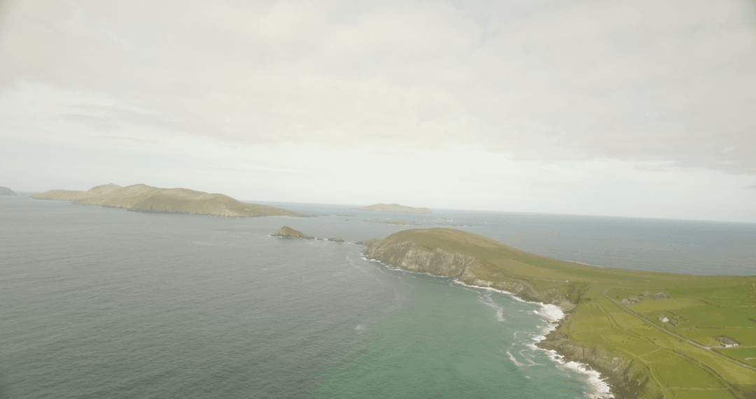 Majestic Aerial View of Scenic Coastal Cliffs and Cloudy Skies
