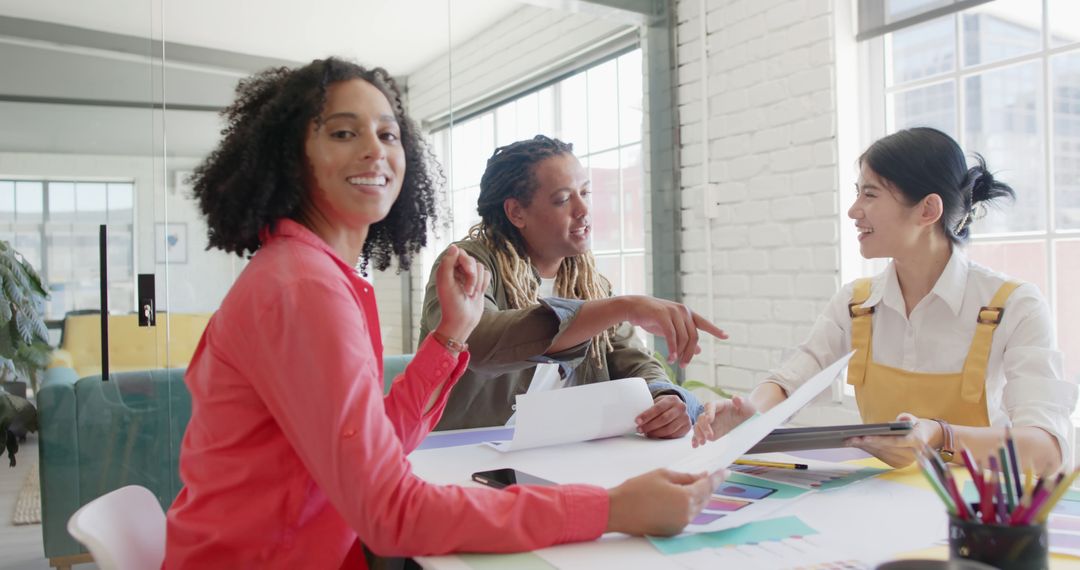 Diverse Creative Design Team Collaborating in Modern Office