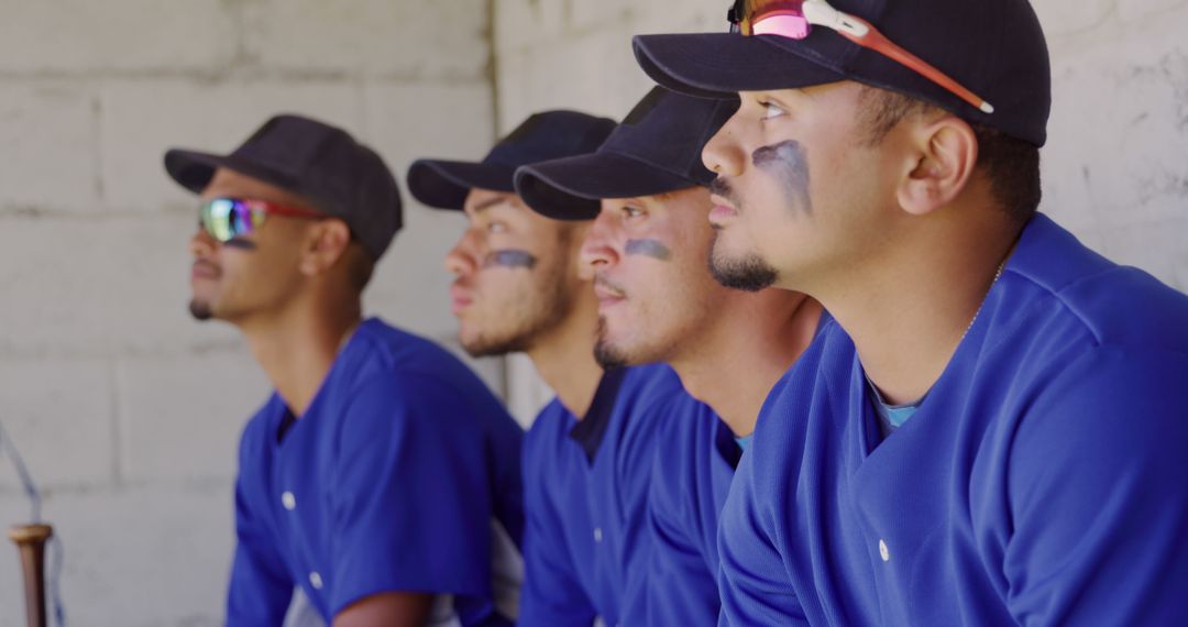 Baseball Players Focusing During Game in Team Dugout - Free Images, Stock Photos and Pictures on Pikwizard.com