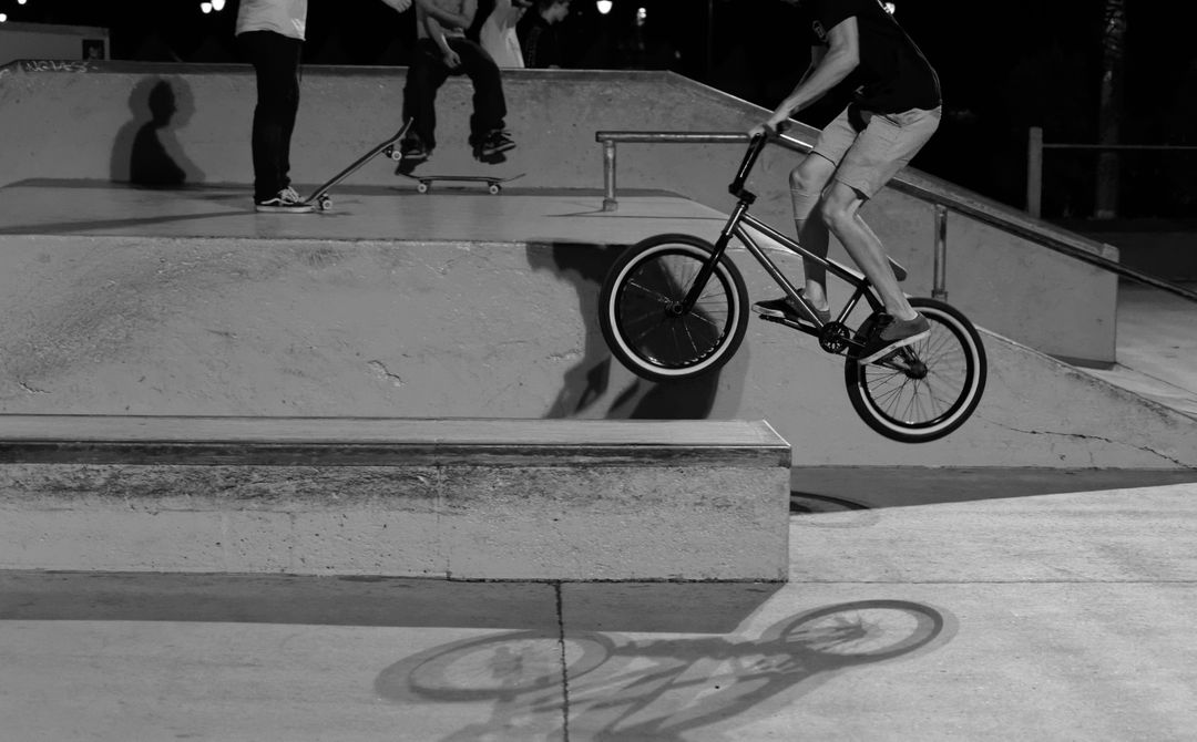 Teenager Performing BMX Trick in Skate Park at Night - Free Images, Stock Photos and Pictures on Pikwizard.com