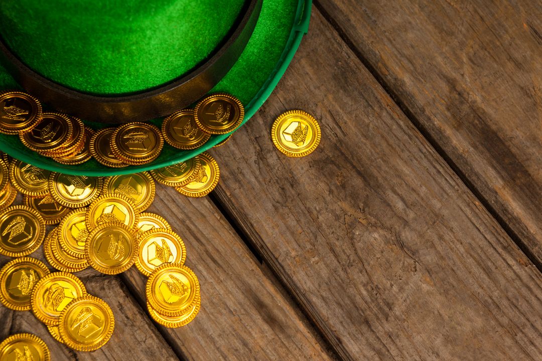 St Patricks Day leprechaun hat with gold chocolate coins - Free Images, Stock Photos and Pictures on Pikwizard.com