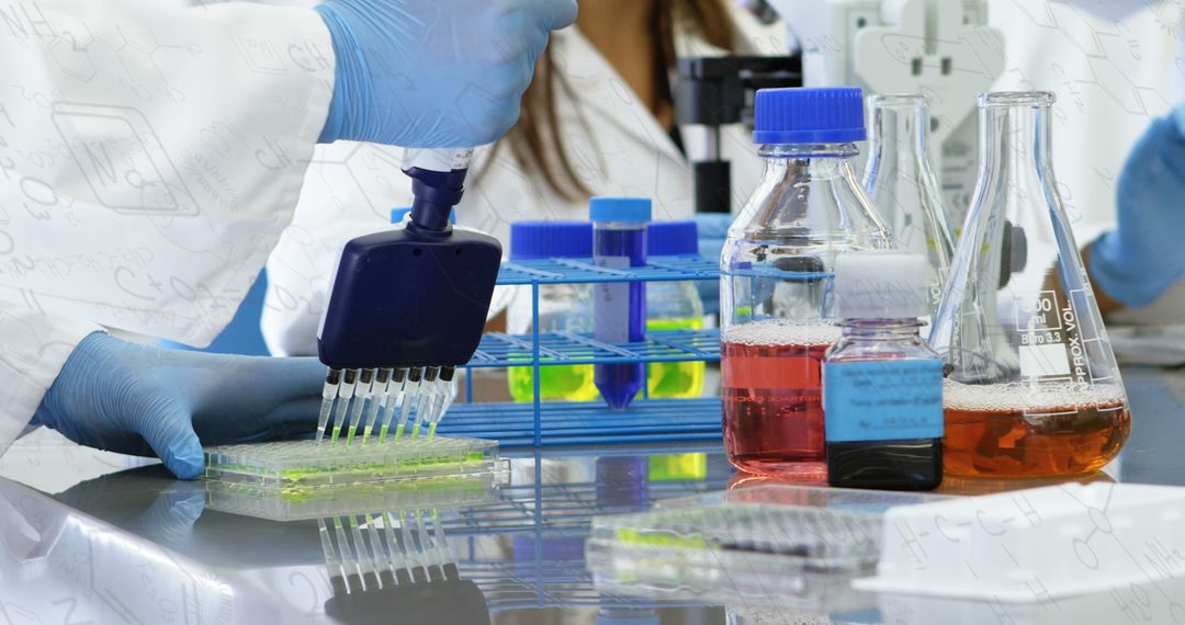 Scientist Handling Microplate in Laboratory Assist Cell Research