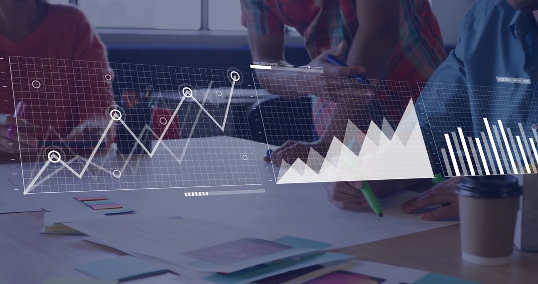 Team Analyzing Financial Data Charts in Modern Office