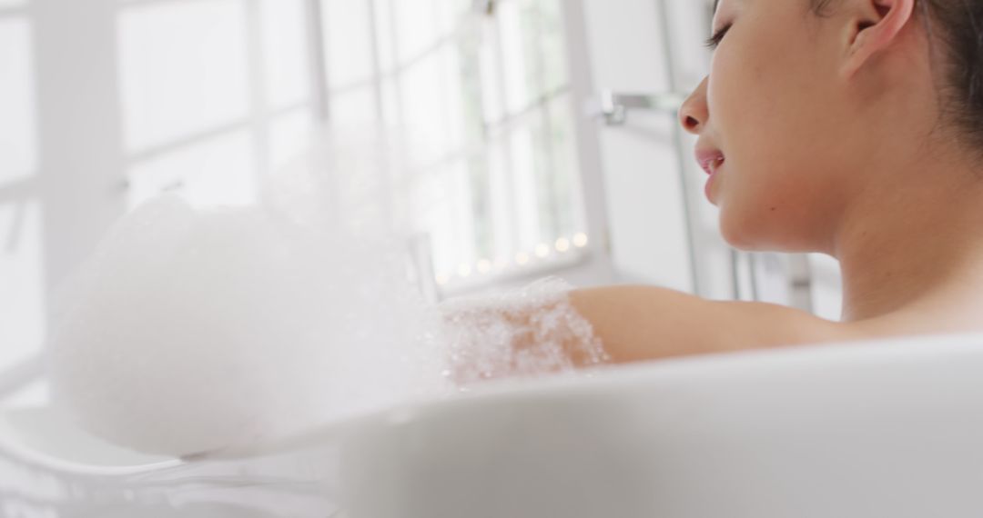 Young Woman Relaxing In Bathtub With Bubbles - Free Images, Stock Photos and Pictures on Pikwizard.com