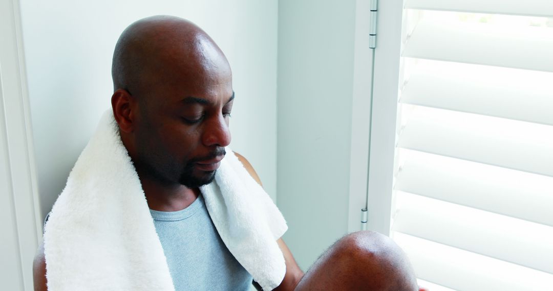 African American Man Relaxing After Workout at Home - Free Images, Stock Photos and Pictures on Pikwizard.com