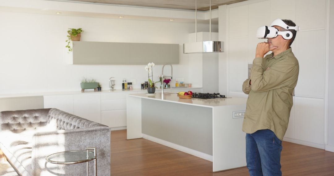 Middle-Aged Man Exploring Modern Home with Virtual Reality Headset
