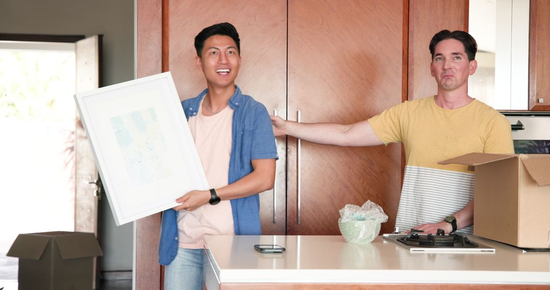 Happy Diverse Couple Unpacking in New Modern Home