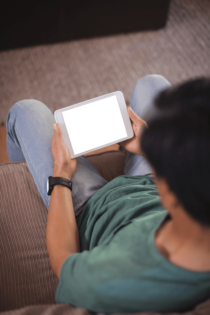 Man Relaxing with Transparent Tablet Screen Living Room