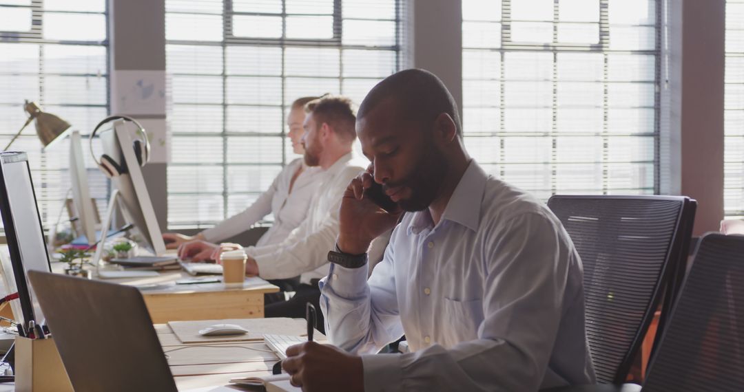 Busy Office Professional Engaged in Phone Conversation