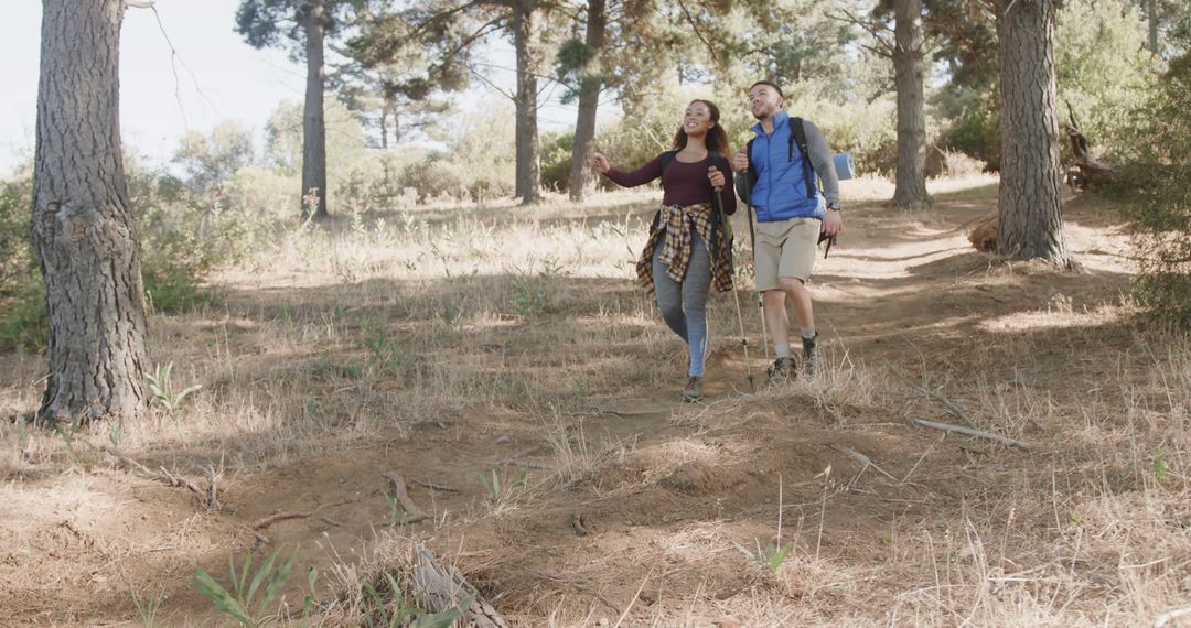 Couple Hiking Through Forest Path, Enjoying Nature - Free Images, Stock Photos and Pictures on Pikwizard.com