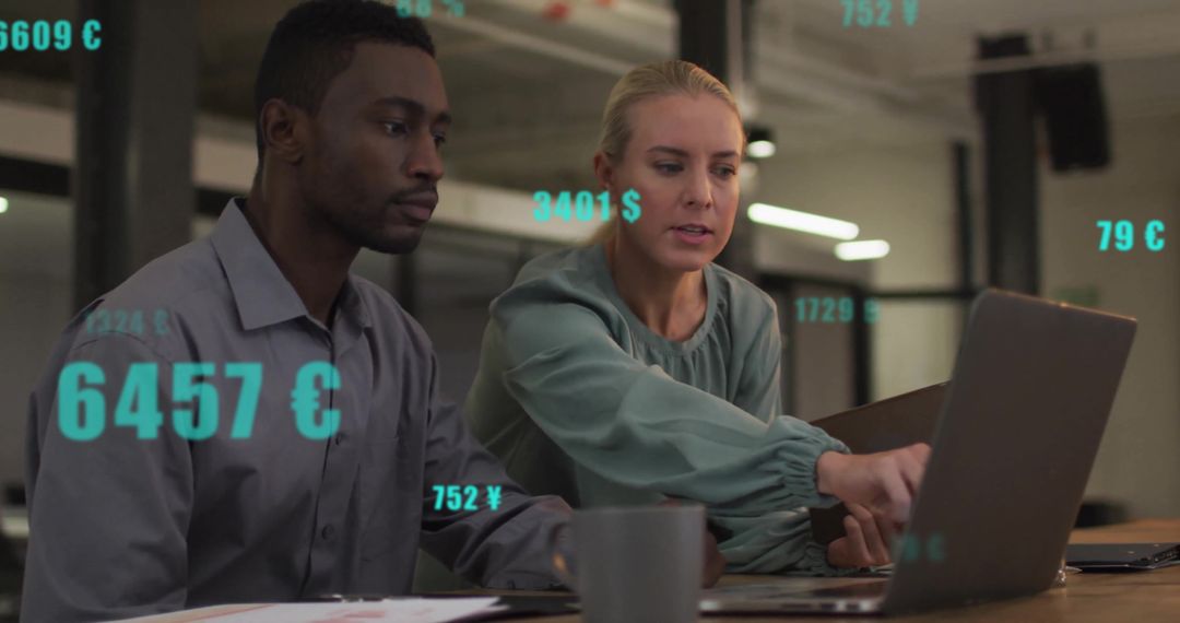 Diverse Colleagues Analyzing Data with Currency Symbols in Office
