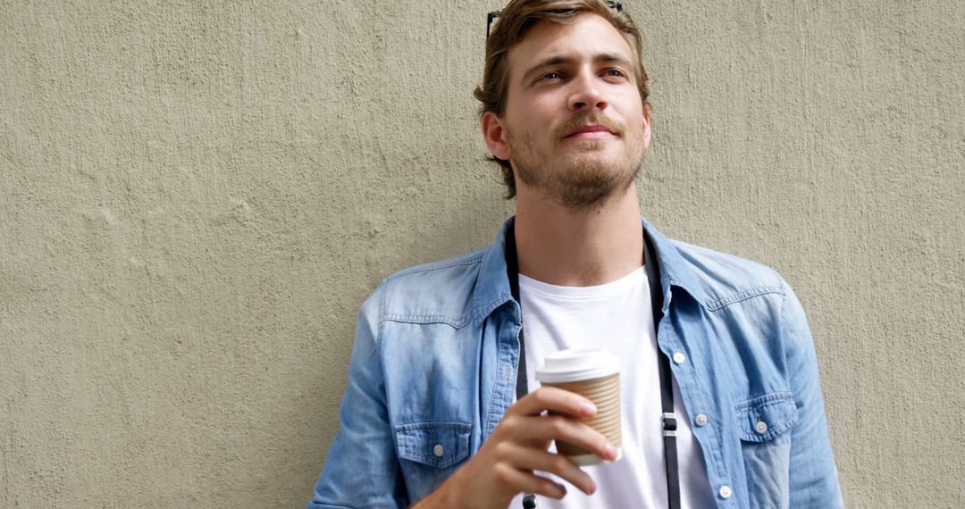 Man Enjoying Coffee Outdoors on Sunny Day - Free Images, Stock Photos and Pictures on Pikwizard.com