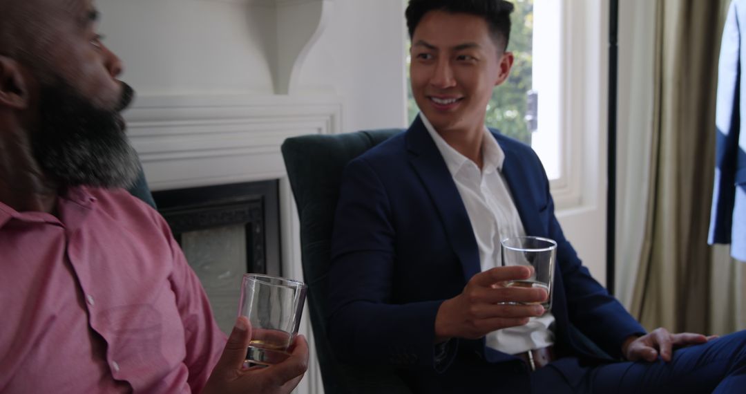Diverse Friends Socializing with Drinks at Home in Formal Attire