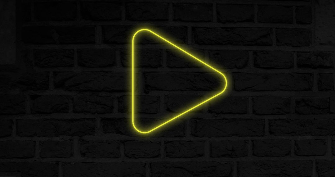 Glowing Neon Play Button Icon on Brick Wall Background - Free Images, Stock Photos and Pictures on Pikwizard.com