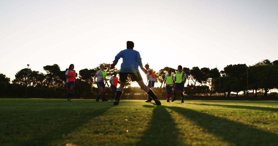 Young Men Playing Soccer During Sunset on Field - Free Images, Stock Photos and Pictures on Pikwizard.com