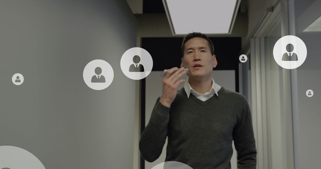 Asian Businessman Analyzing Social Media Data on Smartphone