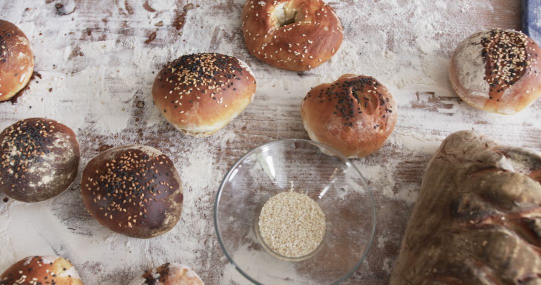 Freshly Baked Artisan Bread and Bagels with Seeds on Wooden Table - Free Images, Stock Photos and Pictures on Pikwizard.com